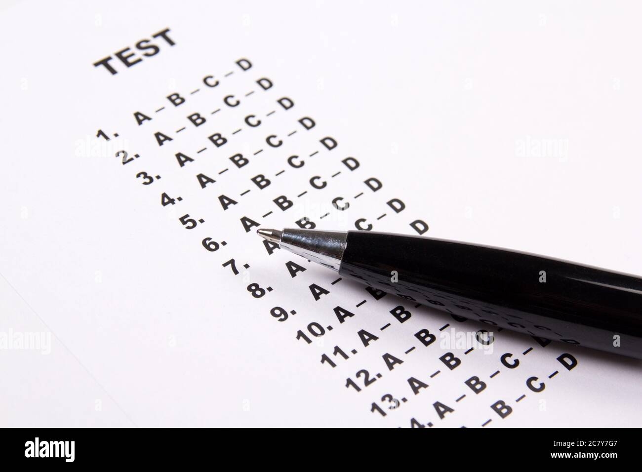 Close Up Of Test Score Sheet Paper With Answers And Metal Pen Close Up Of Test Score Sheet Paper With Answers And Metal Pen